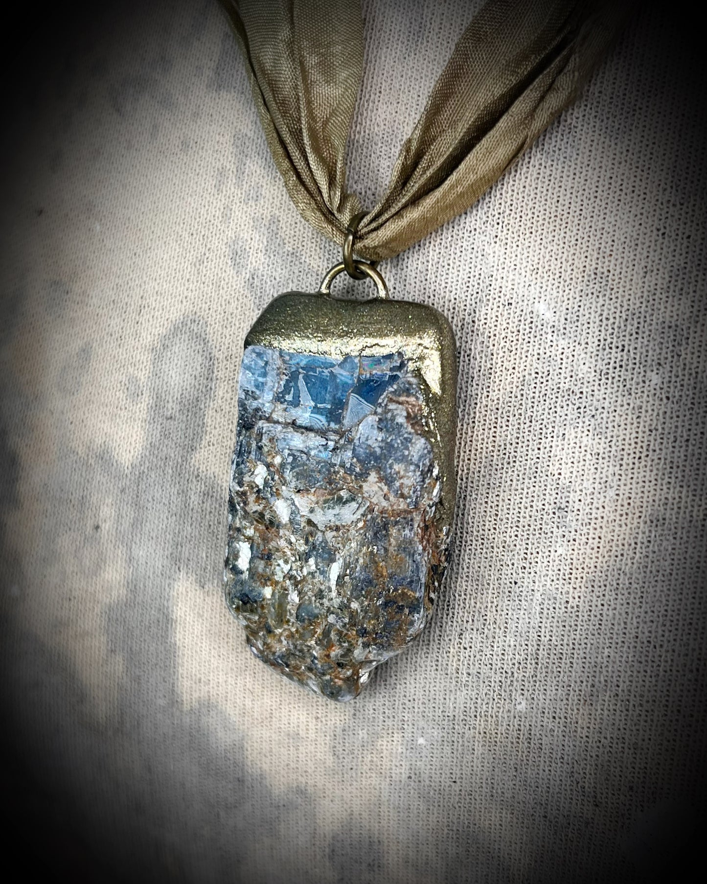 Ocean Blue Kyanite crystal healing throat chakra pendant on recycled silk for speaking your truth. Best travel jewelry for summer, sustainable festival jewelry or wedding necklace.