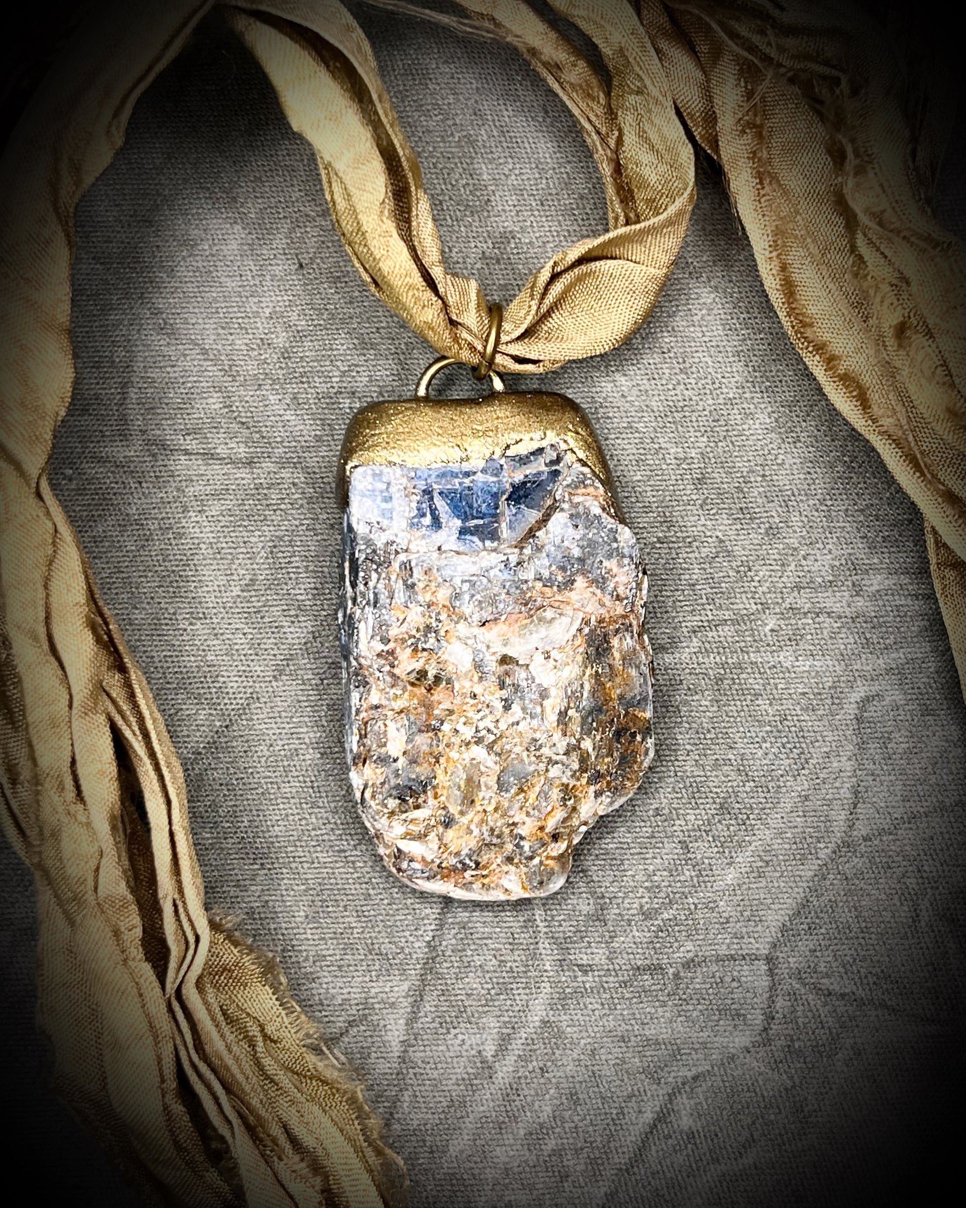 Ocean Blue Kyanite crystal healing throat chakra pendant on recycled silk for speaking your truth. Best travel jewelry for summer, sustainable festival jewelry or wedding necklace.