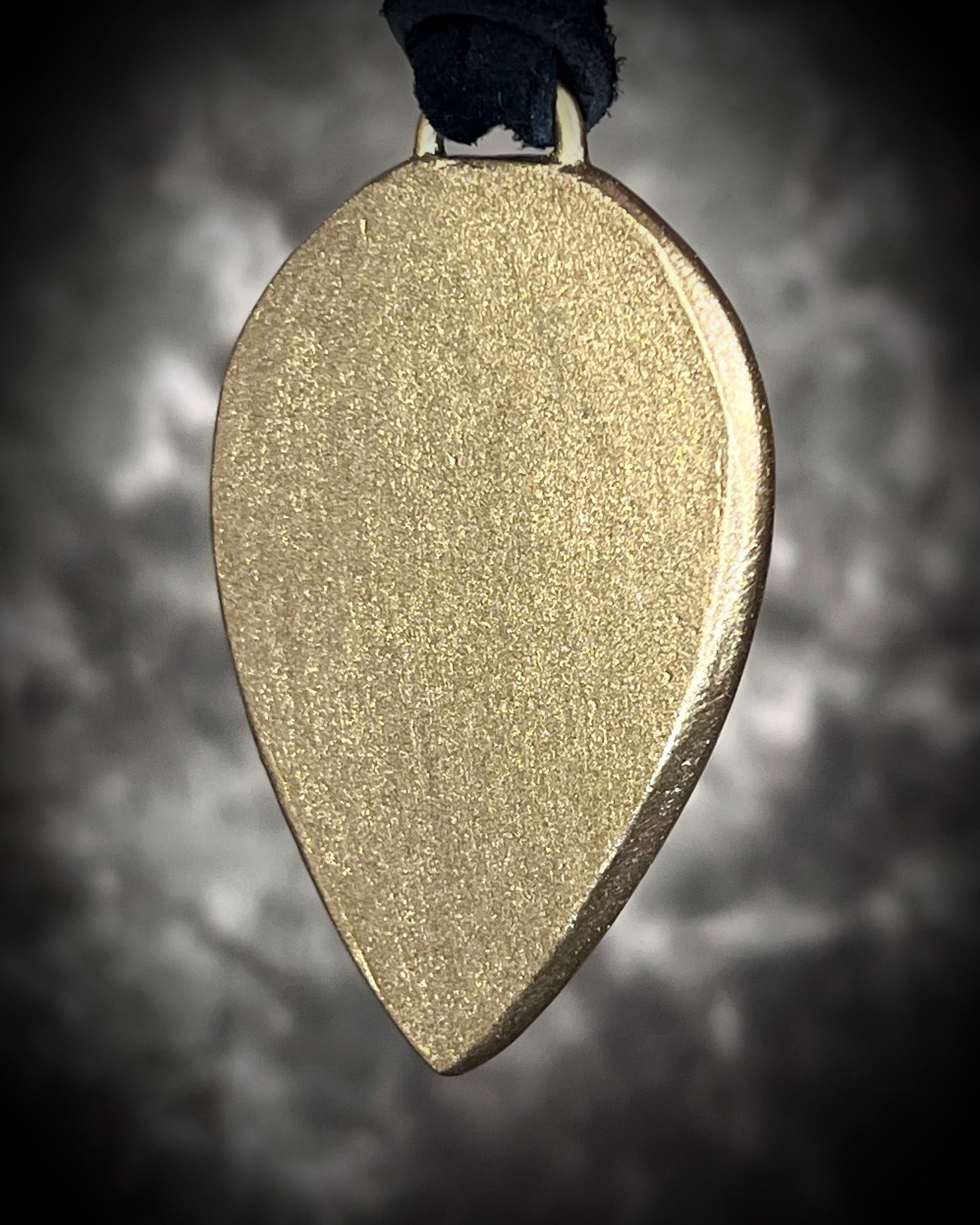 Purple flash moody violet labradorite teardrop crystal necklace in a gold finish on black leather. Handmade mystical jewelry gift for her. 