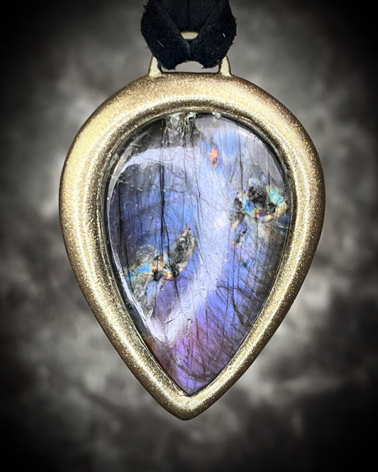 Purple flash moody violet labradorite teardrop crystal necklace in a gold finish on black leather. Handmade mystical jewelry gift for her.  