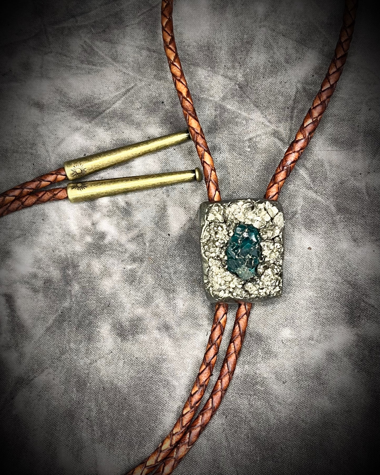 Pyrite and dioptase mosaic crystal bolo tie on brown leather – unique handmade gemstone bolo necklace, artisan gemstone bolo tie jewelry, mystical men’s bolo for bold style.