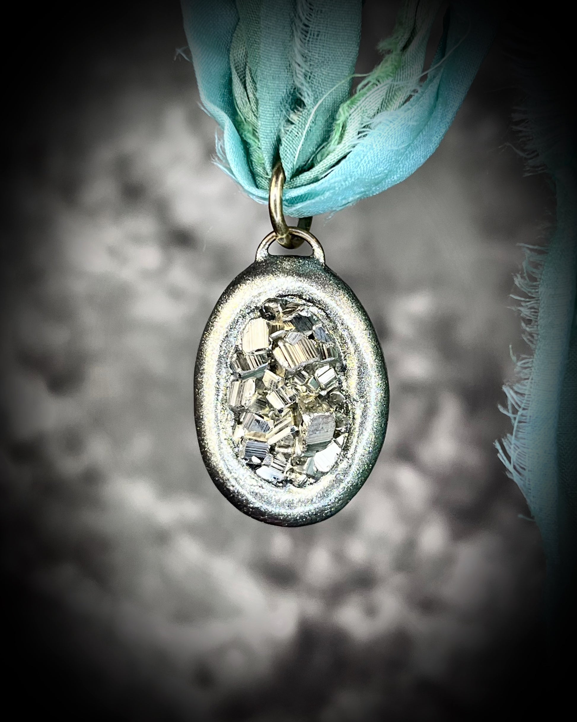 Pyrite crystal handmade necklace on aqua recycled silk for boho summer adventures and manifesting magic, perfect summer jewelry for boho beach adventures and yoga retreats.
