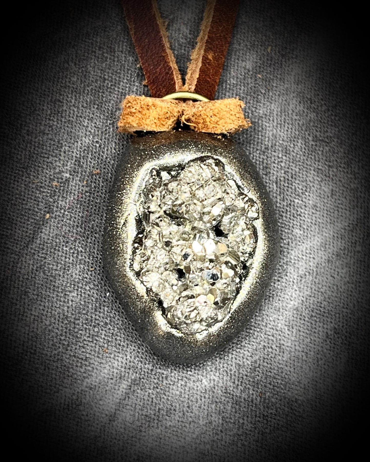 Pyrite handmade crystal pendants on brown earthy leather. Manifestation talismans for holiday gifting, new year resolutions and everyday grounding and protection energy!