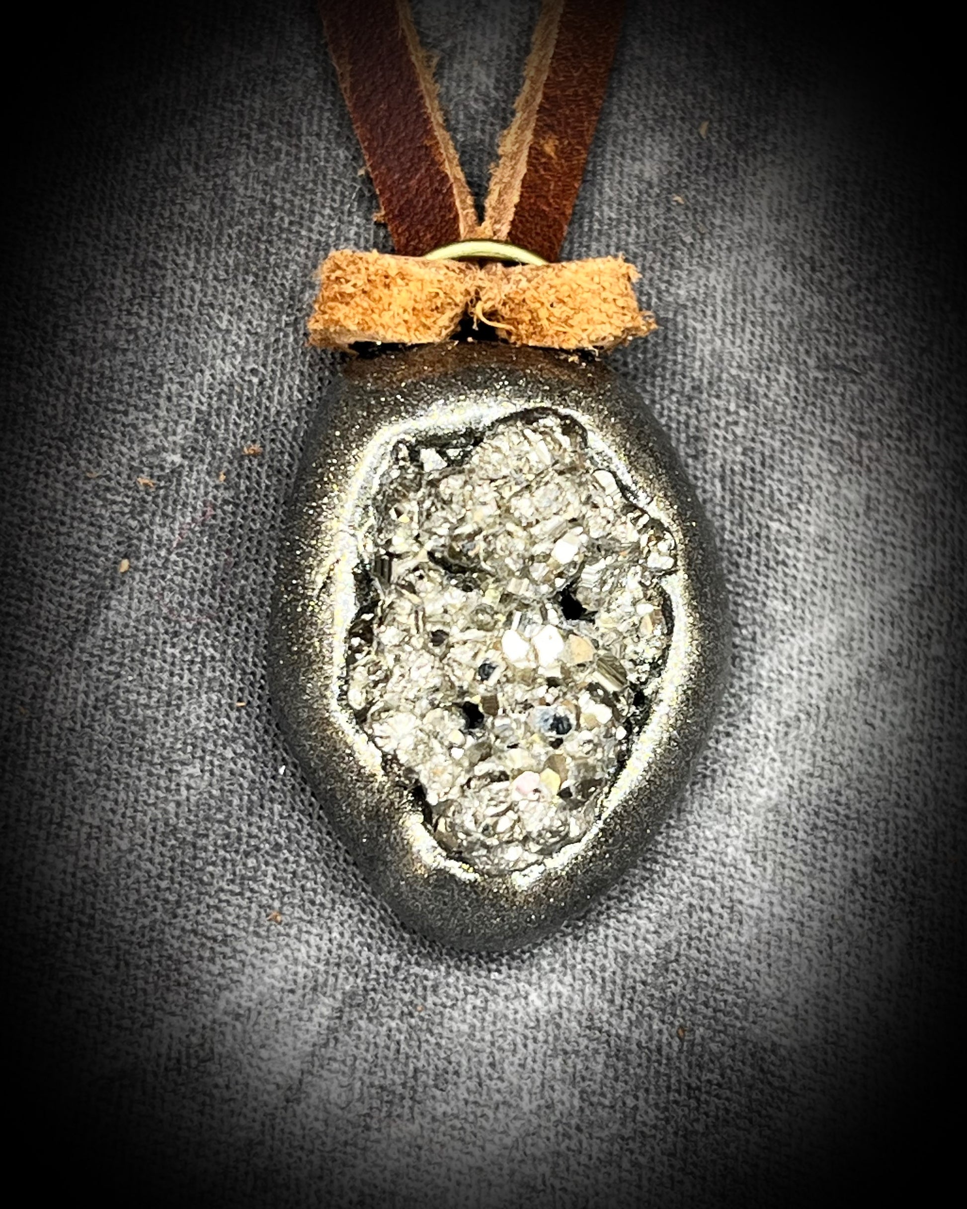 Pyrite handmade crystal pendants on brown earthy leather. Manifestation talismans for holiday gifting, new year resolutions and everyday grounding and protection energy!