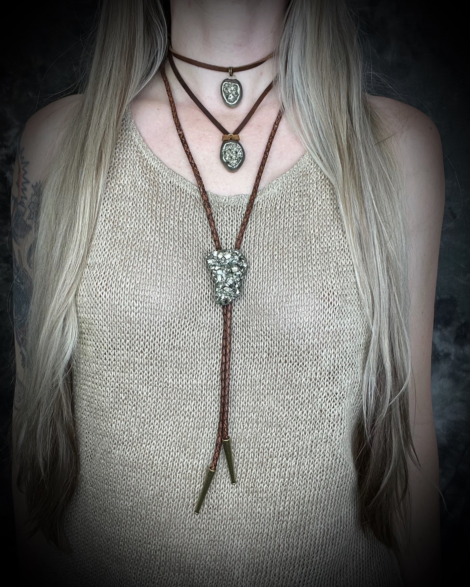 Pyrite handmade crystal pendants on brown earthy leather. Manifestation talismans for holiday gifting, new year resolutions and everyday grounding and protection energy!