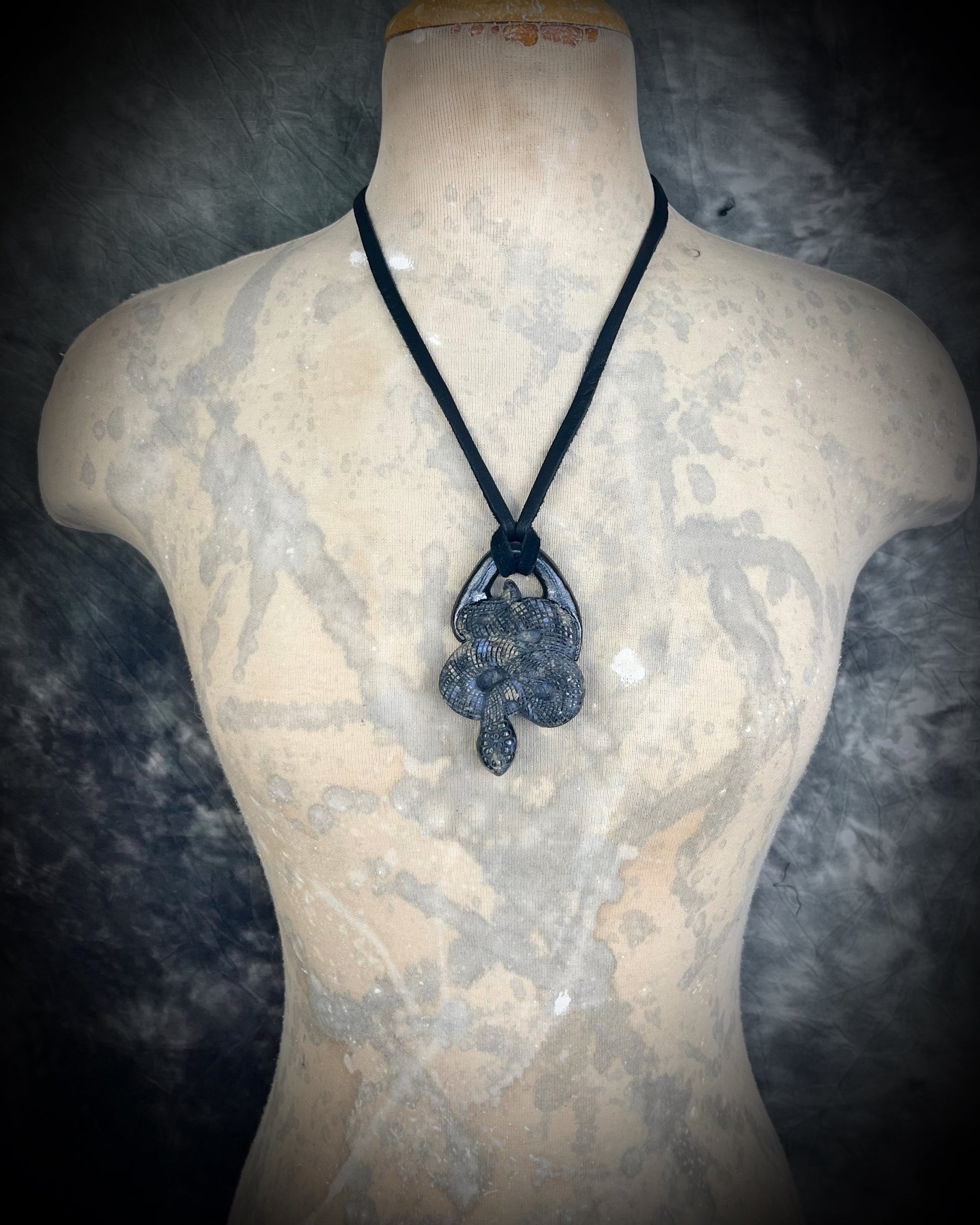 Que Sera crystal carved snake or serpent necklace for 2025 year of the snake.  Handmade and hung from black leather for a mystical goddess. 