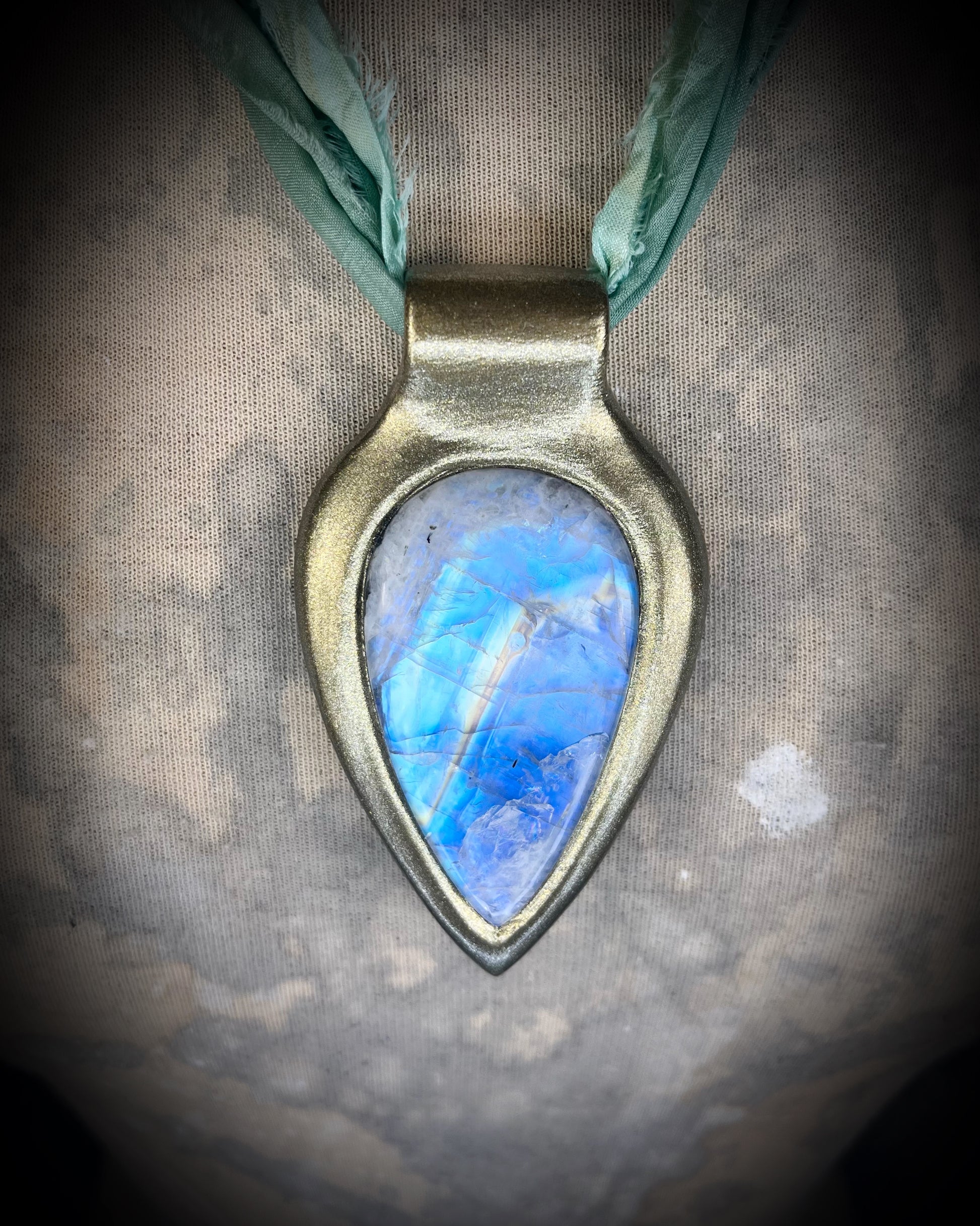 Handmade in the USA sculptural one of a kind statement, maximalist Rainbow Moonstone Necklace.  Goddess inspired and hung from recycled silk for a modern eco-friendly gift!