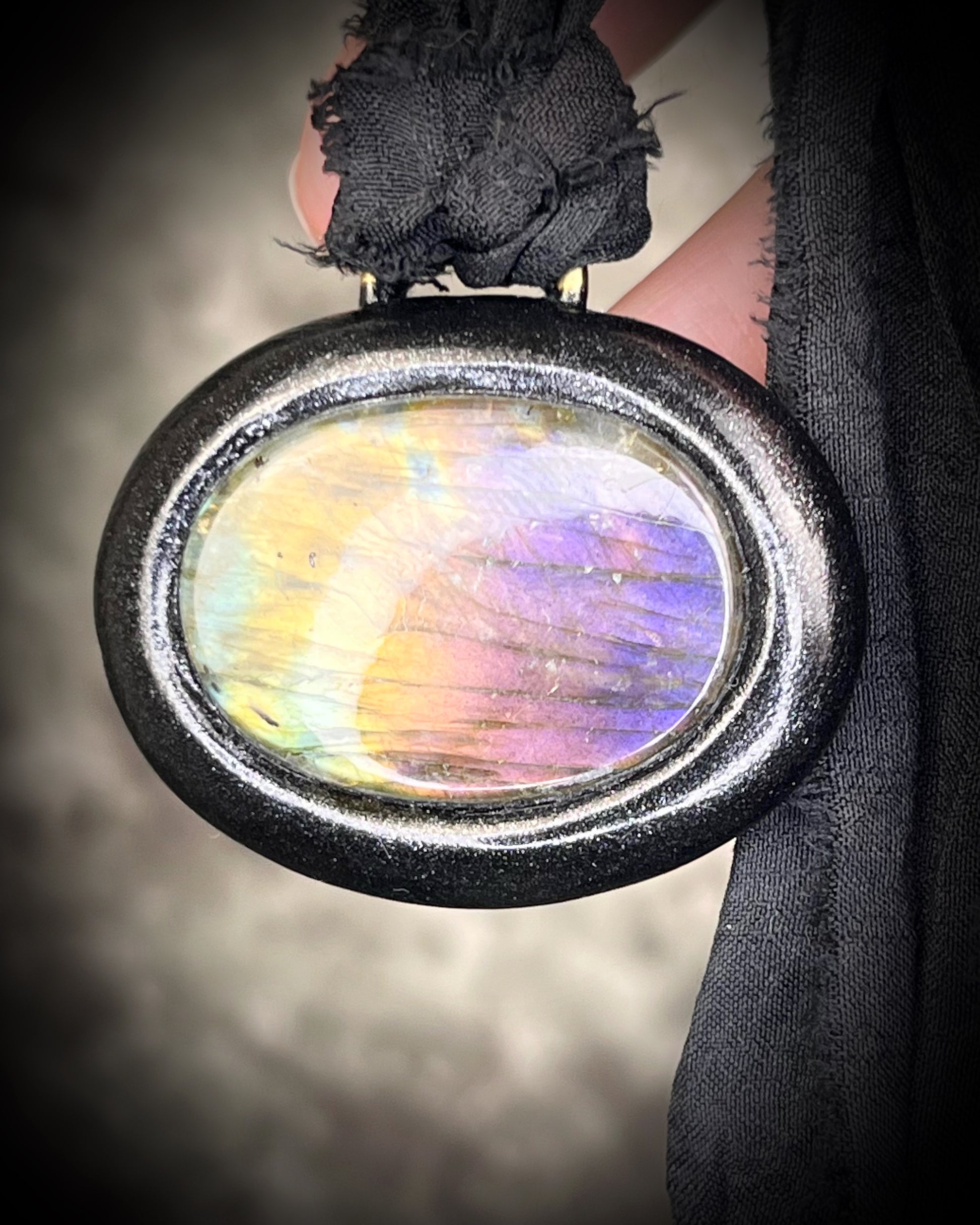 Rainbow labradorite pendant necklace in black frame on recycled silk, statement crystal talisman jewelry for intuition, handmade in Baltimore Maryland 