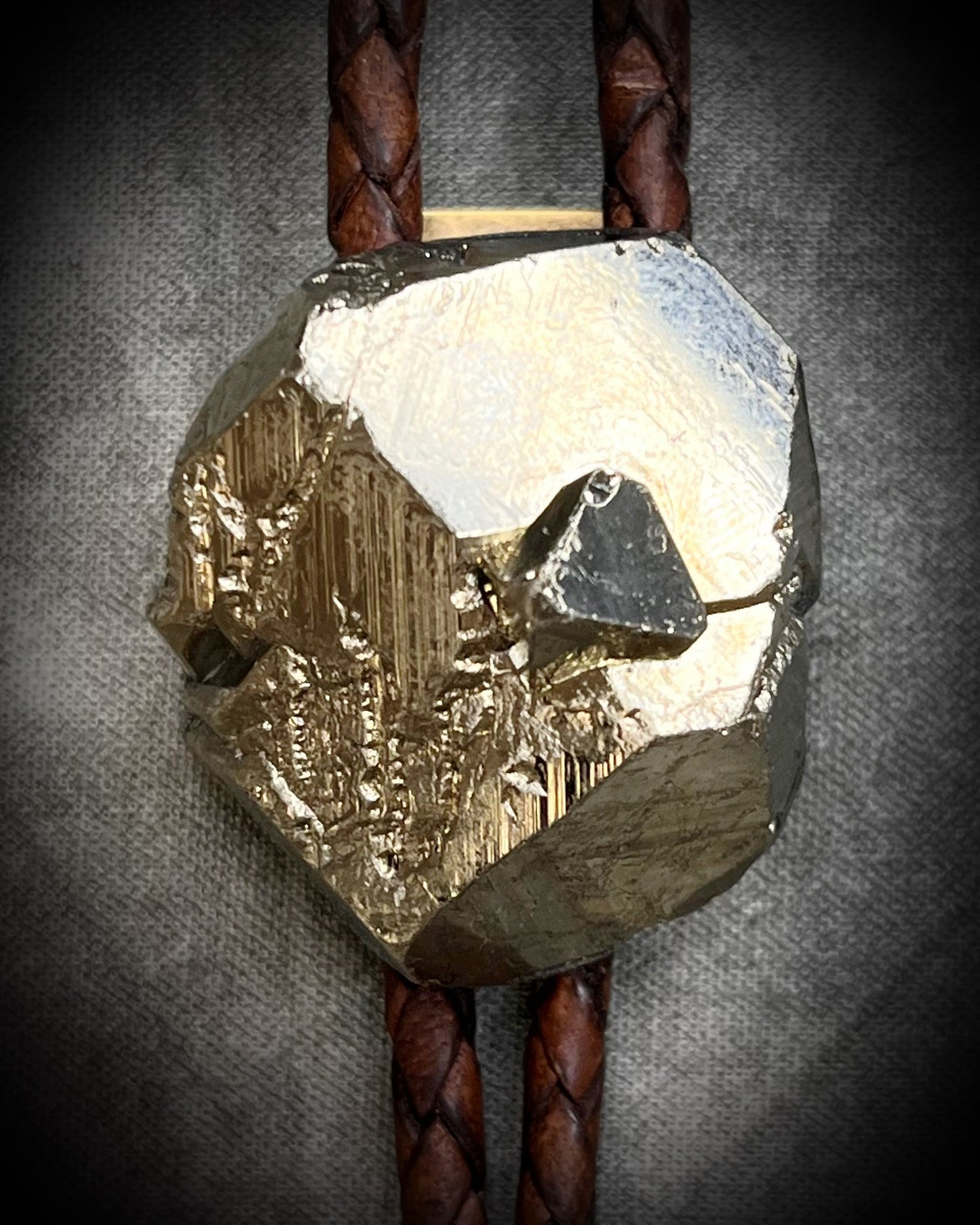 Raw Pyrite gemstone Bolo tie set in an invisible finish and mounted on earthy brown leather. A talisman for ambition, success, and manifestation. Western 2026 jewelry trend bolo. Perfect gift for him!