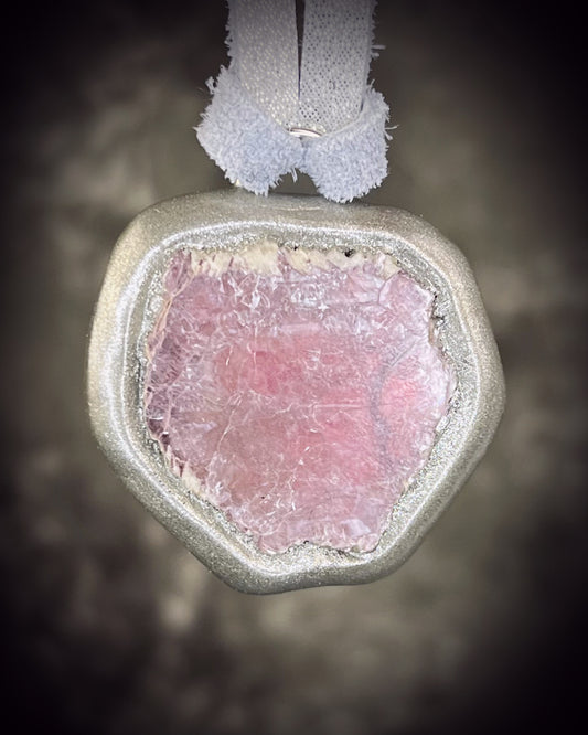 Raw lavender lepidolite crystal talisman in a soft silver finish on shimmering silver leather, handmade by Become Spellbound in Baltimore, Maryland.