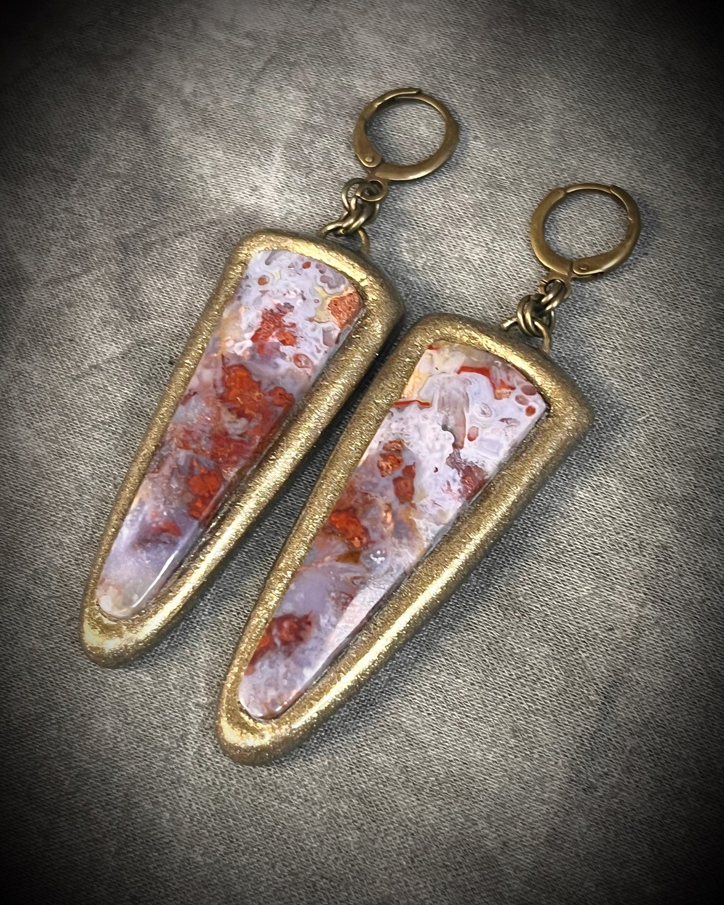 Red moss agate earrings in rich red and lilac colors with hypoallergenic brass huggie hooks in a gold tone, statement gemstone jewelry handmade in Baltimore Maryland. 