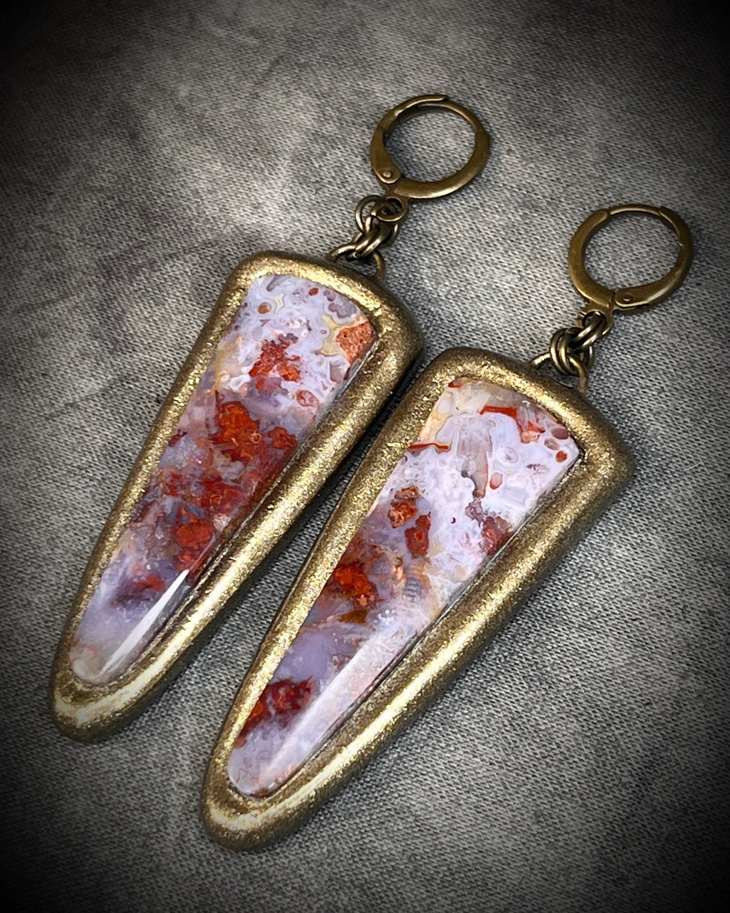 Red moss agate earrings in rich red and lilac colors with hypoallergenic brass huggie hooks in a gold tone, statement gemstone jewelry handmade in Baltimore Maryland. 