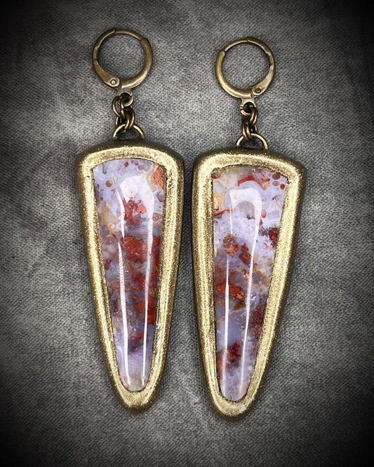 Red moss agate earrings in rich red and lilac colors with hypoallergenic brass huggie hooks in a gold tone, statement gemstone jewelry handmade in Baltimore Maryland. 