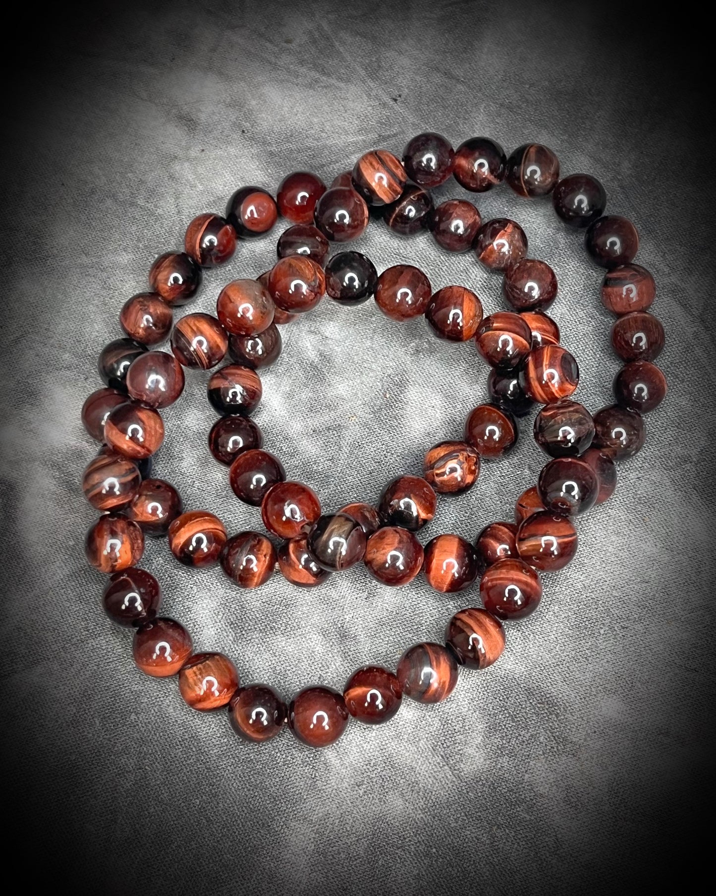 Red tigers eye natural crystal healing beaded bracelets for protection, grounding, emf shielding and gemstone magic!  Crystal stacking bracelets for holiday gifting and new year resolution setting.