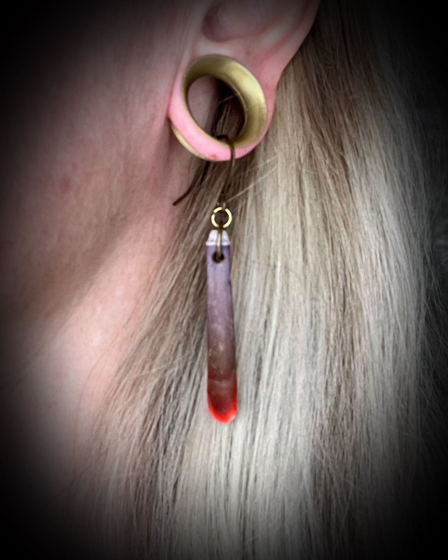 Reddish-purple sea urchin spine earrings on hypoallergenic brass hooks — bohemian ocean inspired statement jewelry.