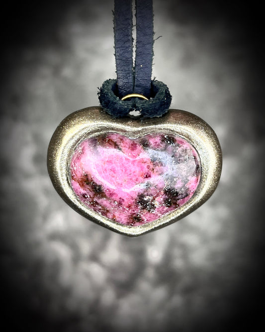 Rhodonite crystal HEART necklace in a gold finish hung from black leather for a grounded crystal healing talisman. Best Valentine's day gift for her.