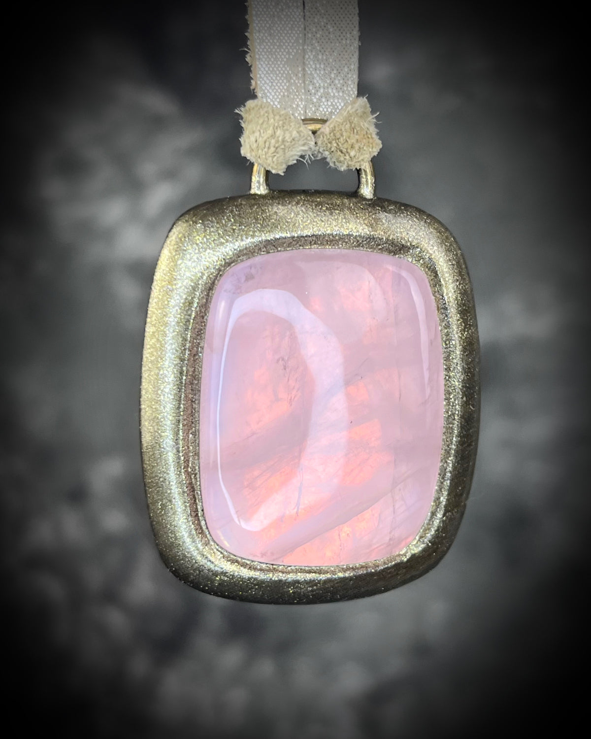 Rose quartz handmade necklace in gold finish on gold shimmering leather. Artisan jewelry made by Baltimore's Best Jeweler  2026 winner Become Spellbound. 