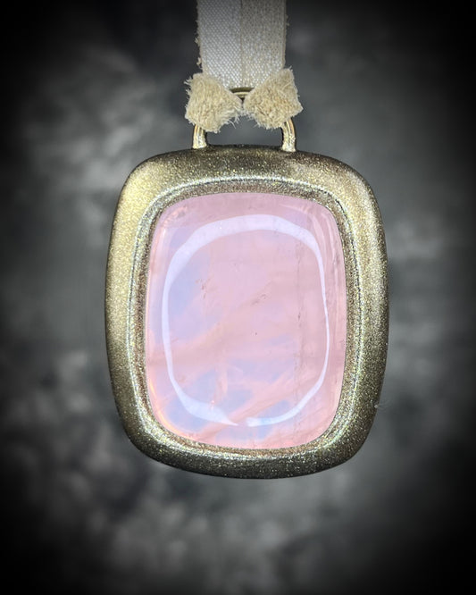 Rose quartz handmade necklace in gold finish on gold shimmering leather. Artisan jewelry made by Baltimore's Best Jeweler  2026 winner Become Spellbound. 