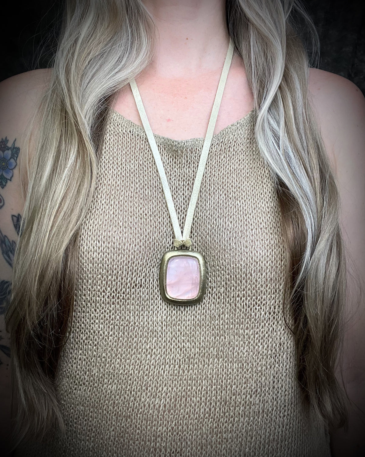 Rose quartz handmade necklace in gold finish on gold shimmering leather. Artisan jewelry made by Baltimore's Best Jeweler  2026 winner Become Spellbound. 