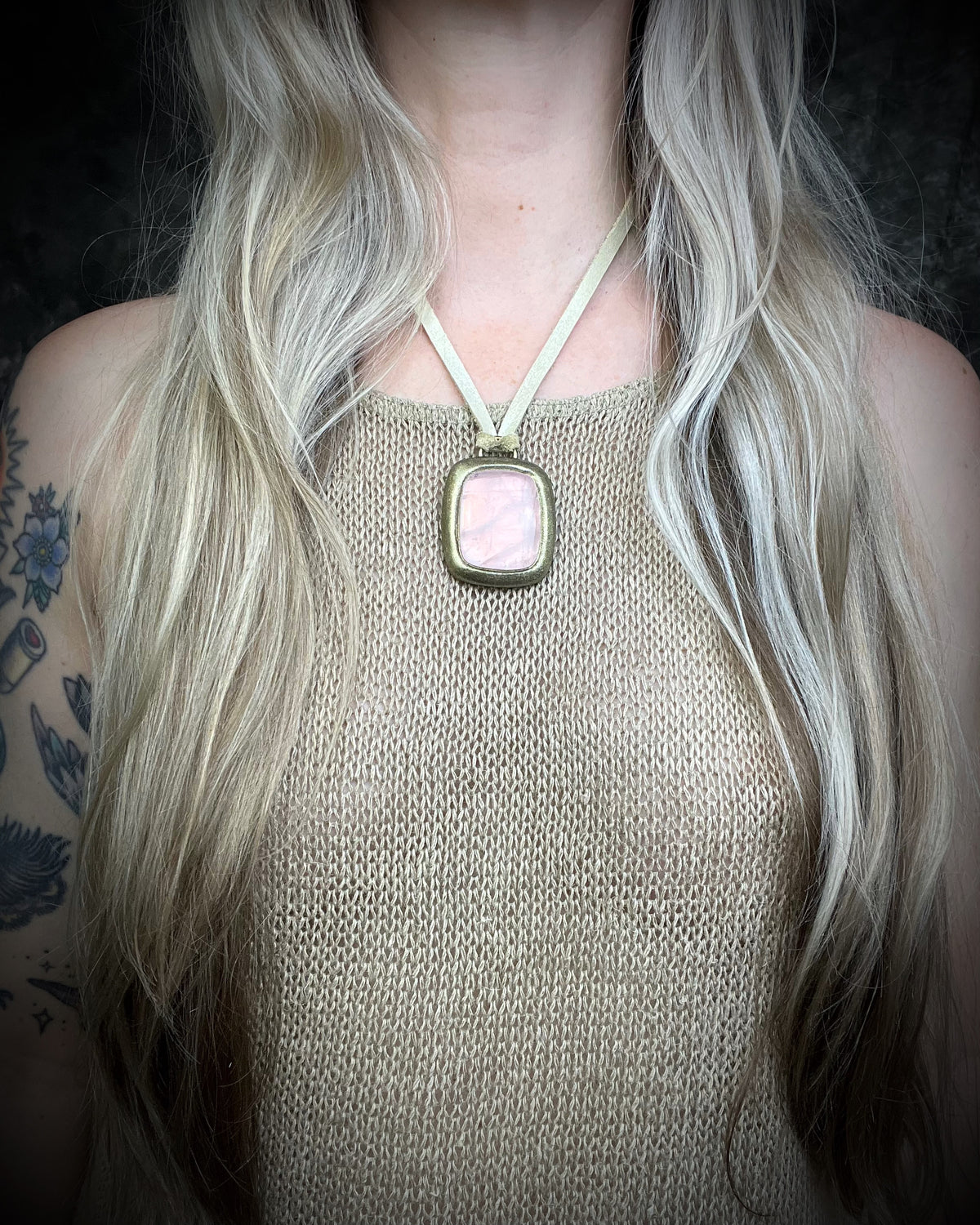 Rose quartz handmade necklace in gold finish on gold shimmering leather. Artisan jewelry made by Baltimore's Best Jeweler  2026 winner Become Spellbound. 