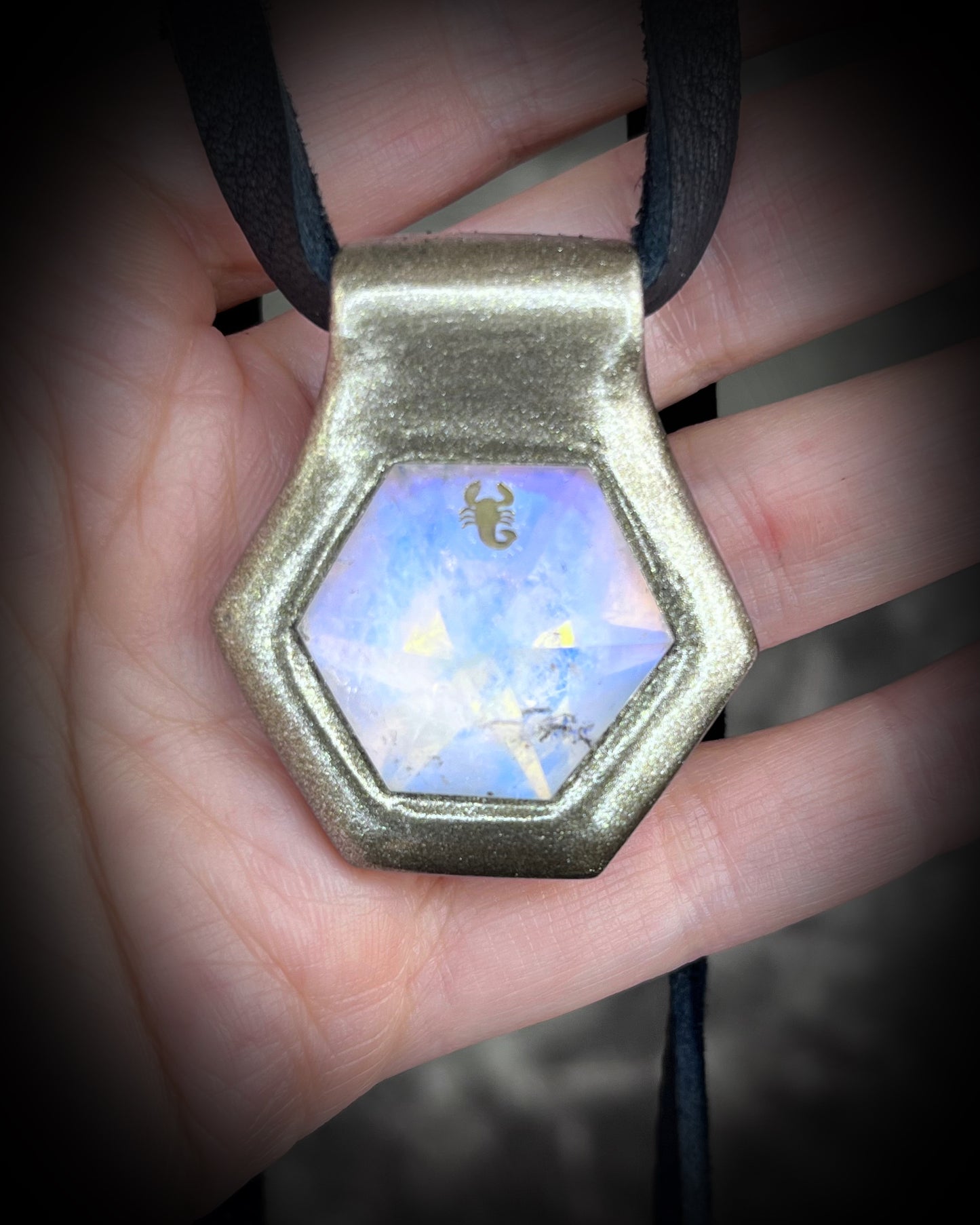 Scorpio gemstone birthstone necklace in gold finish on black leather. Opalescent quartz talisman for Scorpio or scorpion lovers.