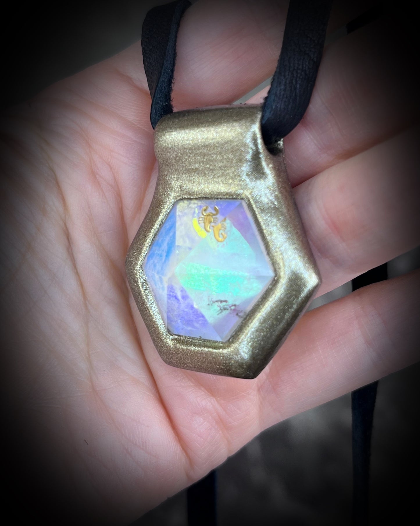 Scorpio gemstone birthstone necklace in gold finish on black leather. Opalescent quartz talisman for Scorpio or scorpion lovers.