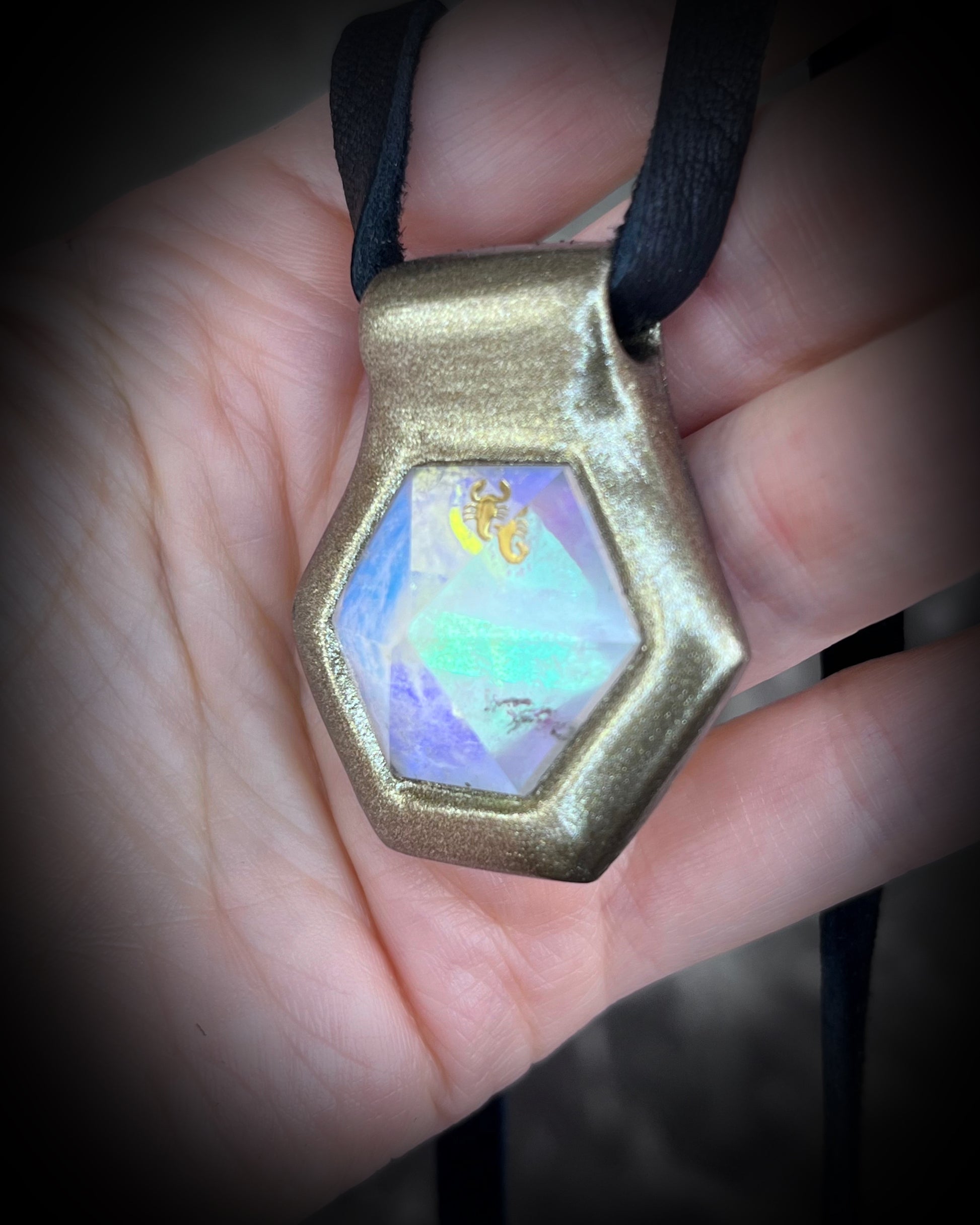 Scorpio gemstone birthstone necklace in gold finish on black leather. Opalescent quartz talisman for Scorpio or scorpion lovers.