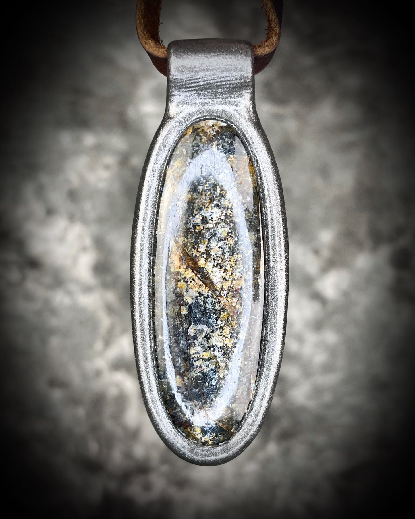 Shimmering moss kyanite crystal healing talisman in dark silver finish hung from soft and rugged brown leather. Gift intuition, transformation and communication.