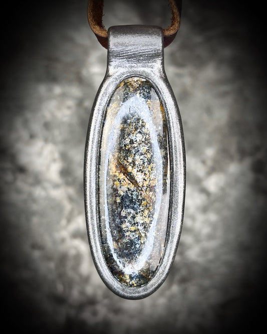 Shimmering moss kyanite crystal healing talisman in dark silver finish hung from soft and rugged brown leather. Gift intuition, transformation and communication.