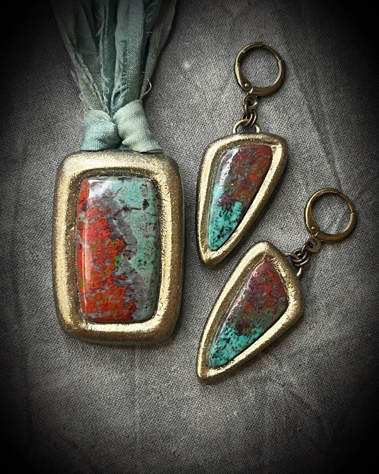 Sonora Sunrise Chrysocolla Earrings in Gold Finish with Brass Huggie Hooks. Shown here with matching red and turquoise gemstone pendant. 