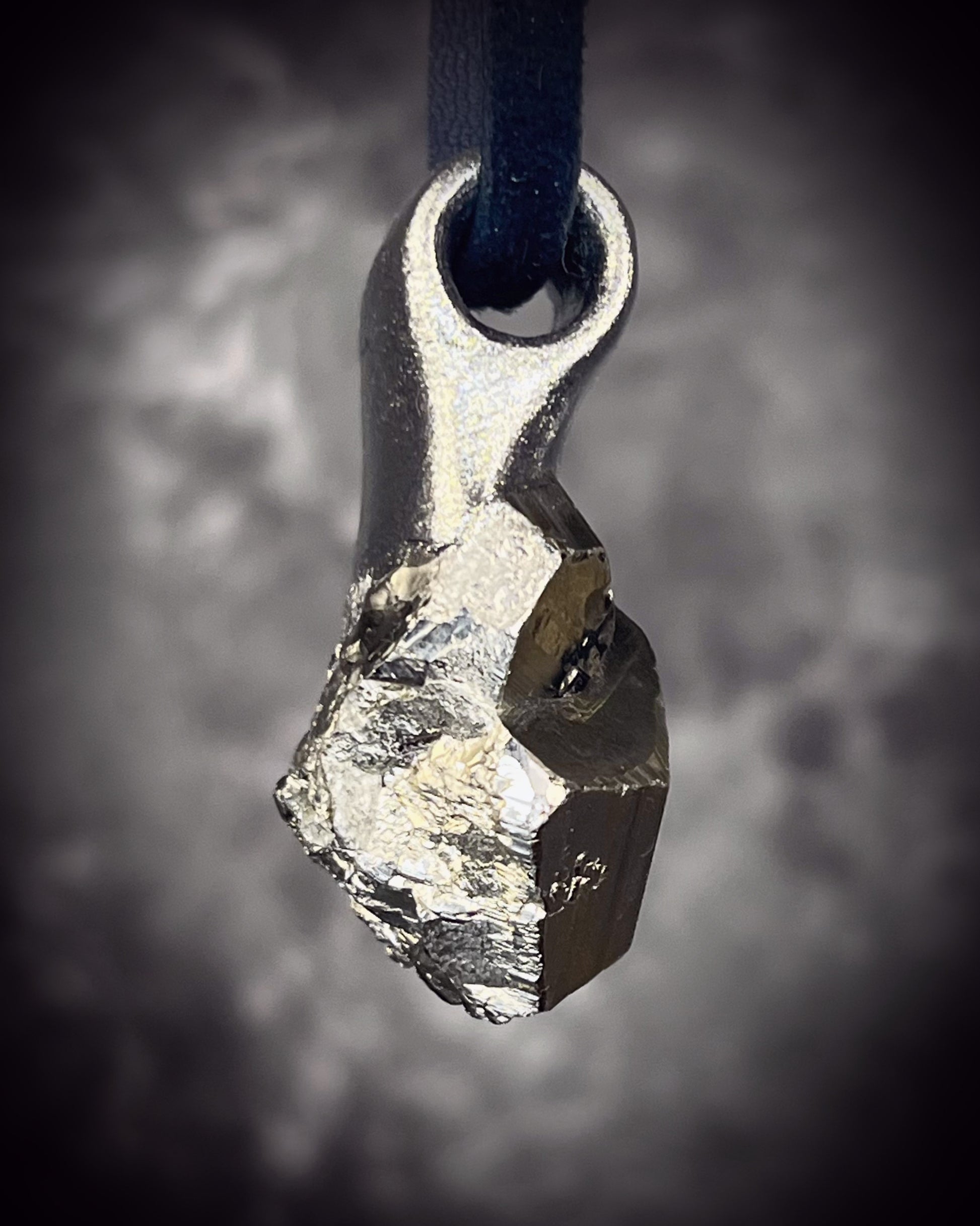 Sparkling Peruvian pyrite talisman with natural cubic formations on brown leather, handmade by Become Spellbound in Baltimore, Maryland.