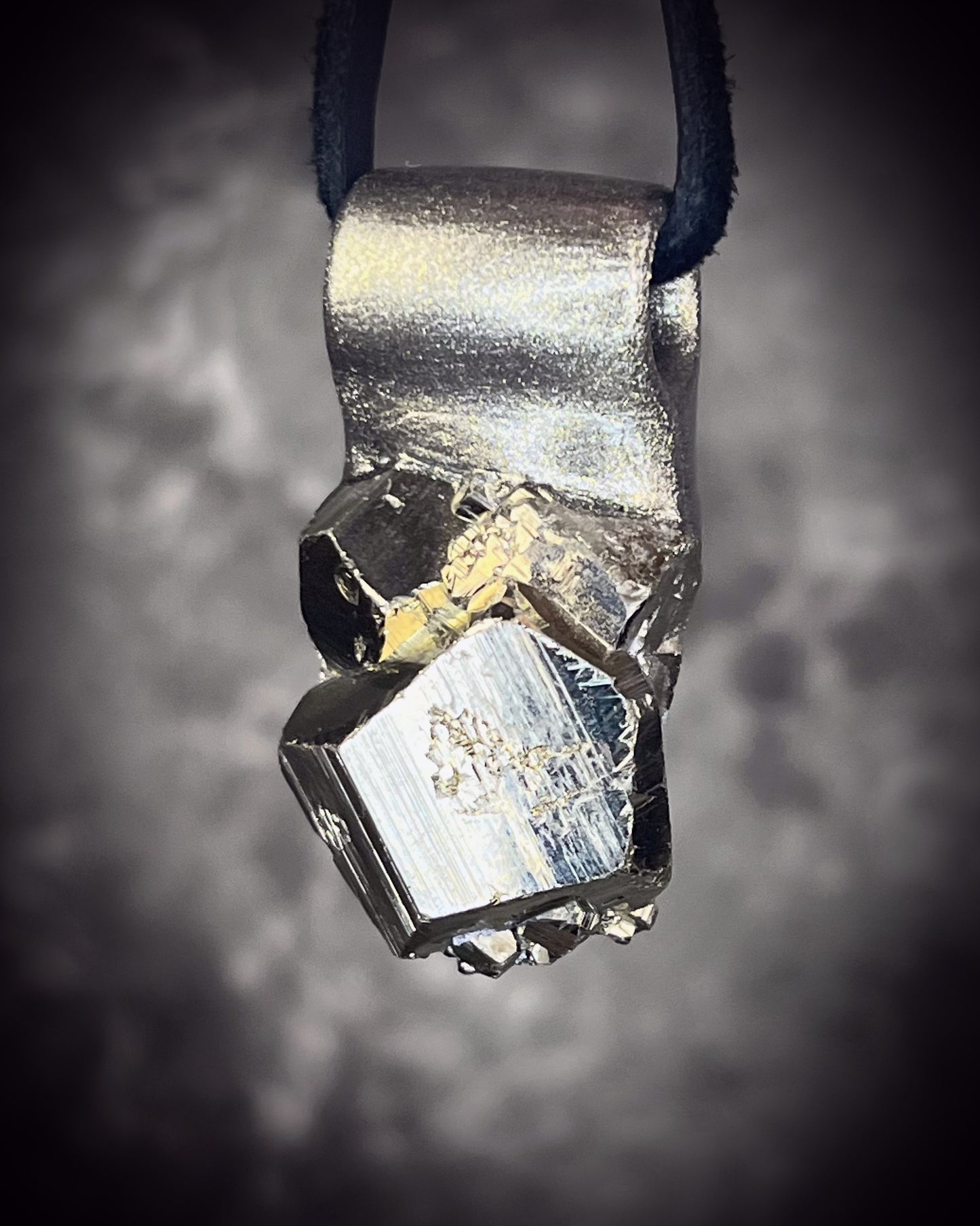 Sparkling Peruvian pyrite talisman with natural cubic formations on brown leather, handmade by Become Spellbound in Baltimore, Maryland.