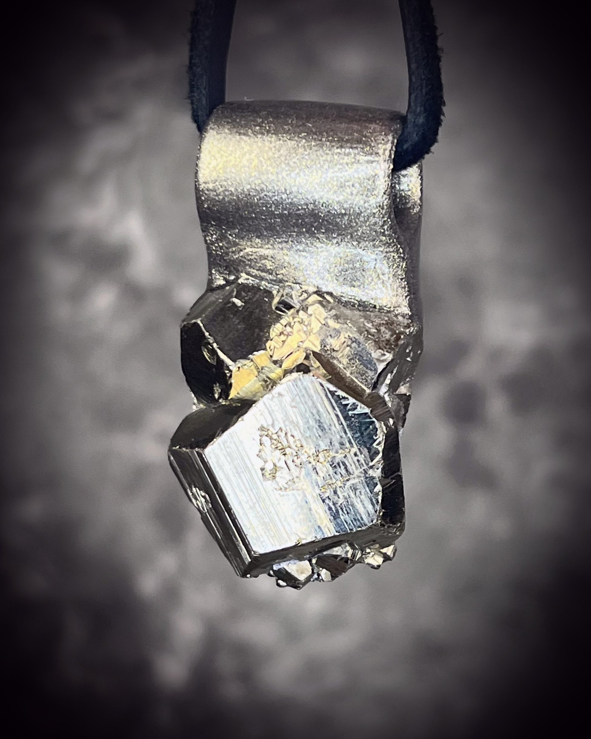 Sparkling Peruvian pyrite talisman with natural cubic formations on brown leather, handmade by Become Spellbound in Baltimore, Maryland.