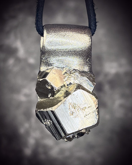 Sparkling Peruvian pyrite talisman with natural cubic formations on brown leather, handmade by Become Spellbound in Baltimore, Maryland.