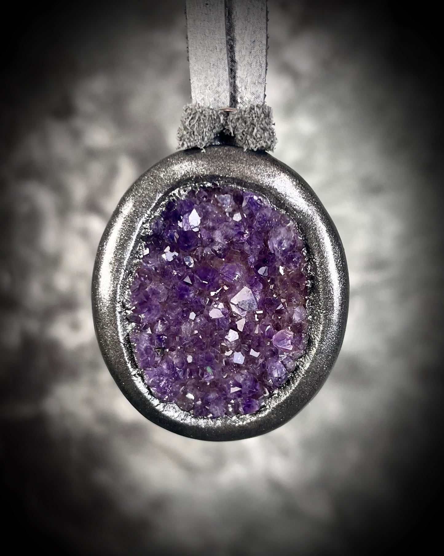 Sparkling druzy amethyst oval pendant in dark gunmetal silver on silver leather cord. Mystical crystal necklace for intuition, healing, and protection, handmade statement jewelry for spiritual seekers and gemstone lovers."