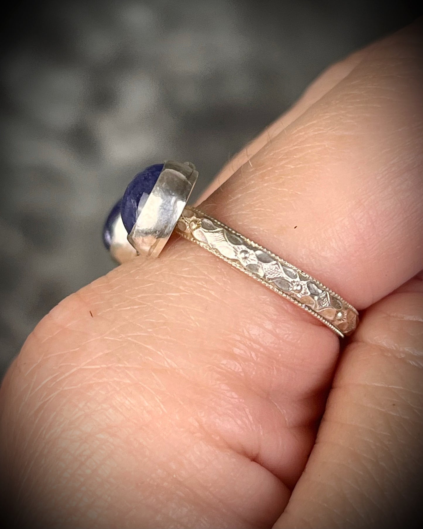 Tanzanite sterling silver moon ring with slightly adjustable band, celestial gemstone jewelry with violet blue stone for intuition and spiritual connection. Side view, band texture. 