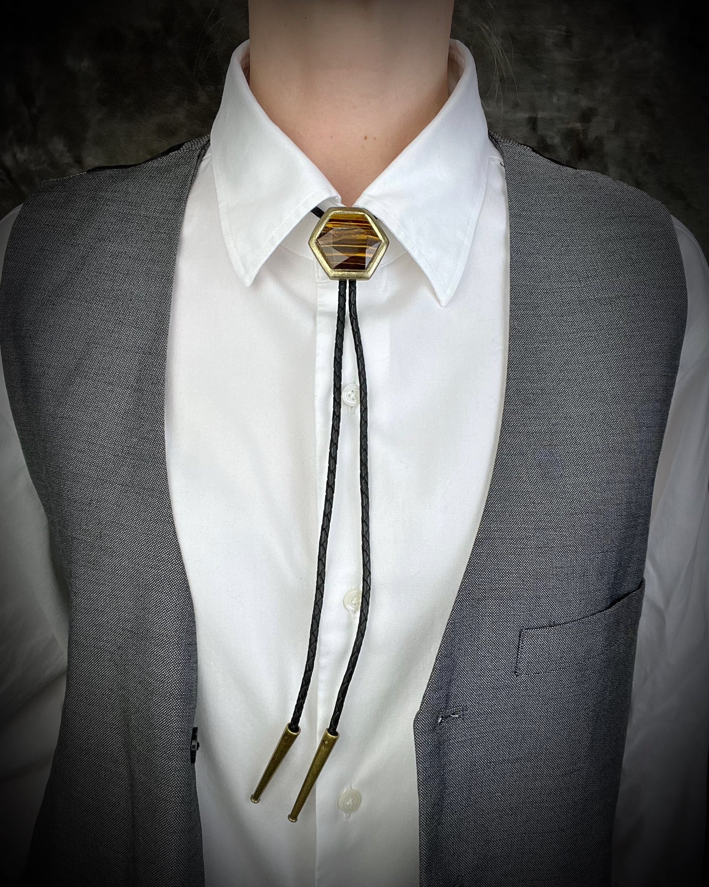 Tiger’s Eye hexagon bolo tie on black leather – statement men’s bolo necklace, crystal bolo tie jewelry, mystical Western bolo for festival fashion.