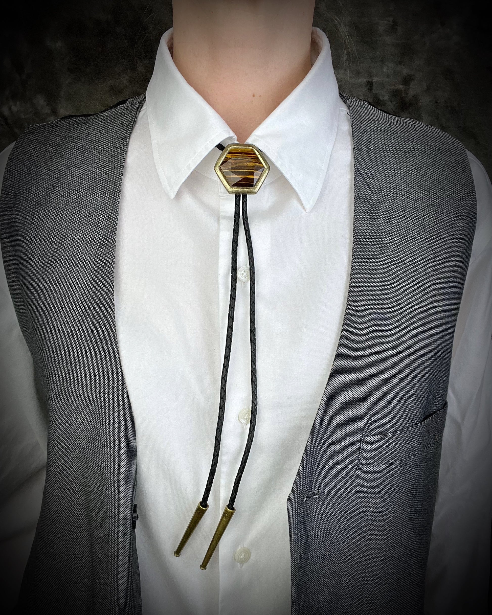 Tiger’s Eye hexagon bolo tie on black leather – statement men’s bolo necklace, crystal bolo tie jewelry, mystical Western bolo for festival fashion.