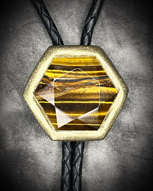 Tiger’s Eye hexagon bolo tie on black leather – statement men’s bolo necklace, crystal bolo tie jewelry, mystical Western bolo for festival fashion.