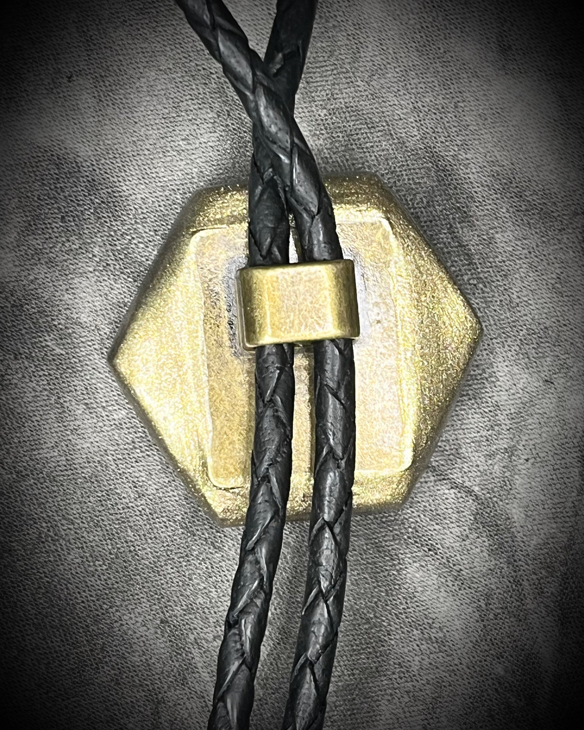 Tiger’s Eye hexagon bolo tie on black leather – statement men’s bolo necklace, crystal bolo tie jewelry, mystical Western bolo for festival fashion.