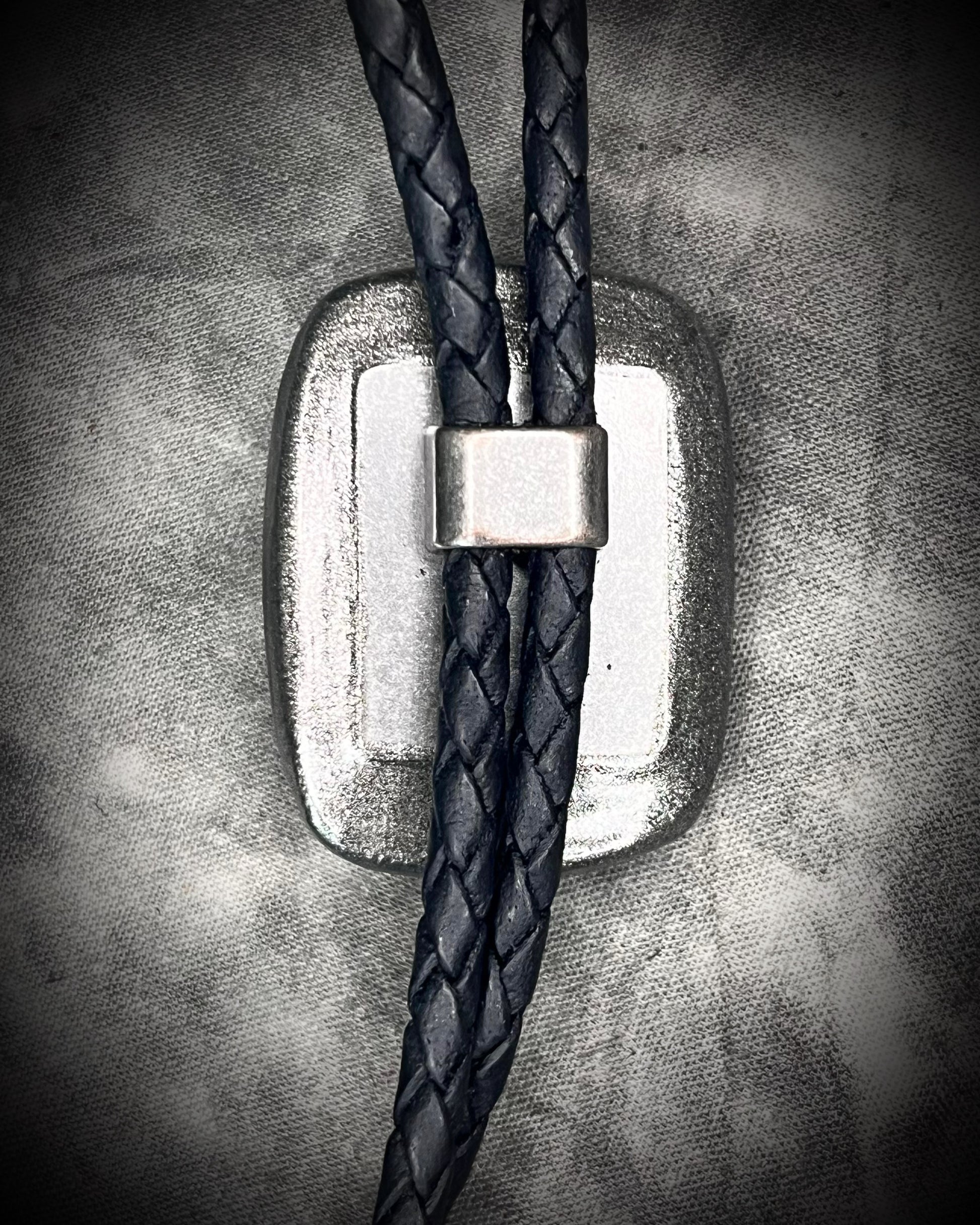 Labradorite Crystal bolo tie jewelry. Trending men’s accessories fall 2025. Statement bolo tie with gemstones. Alternative men’s fashion jewelry. Gender-fluid bolo tie styling. Western-inspired necklace with crystals. Unique leather bolo tie for him or her.