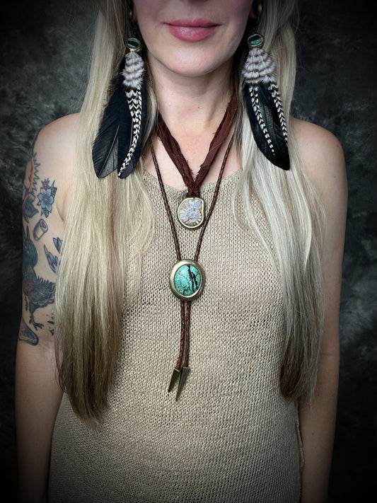 Turquoise and feather earrings with natural blue-green stone, gold finish, and hypoallergenic brass huggie hooks, handmade by Become Spellbound.