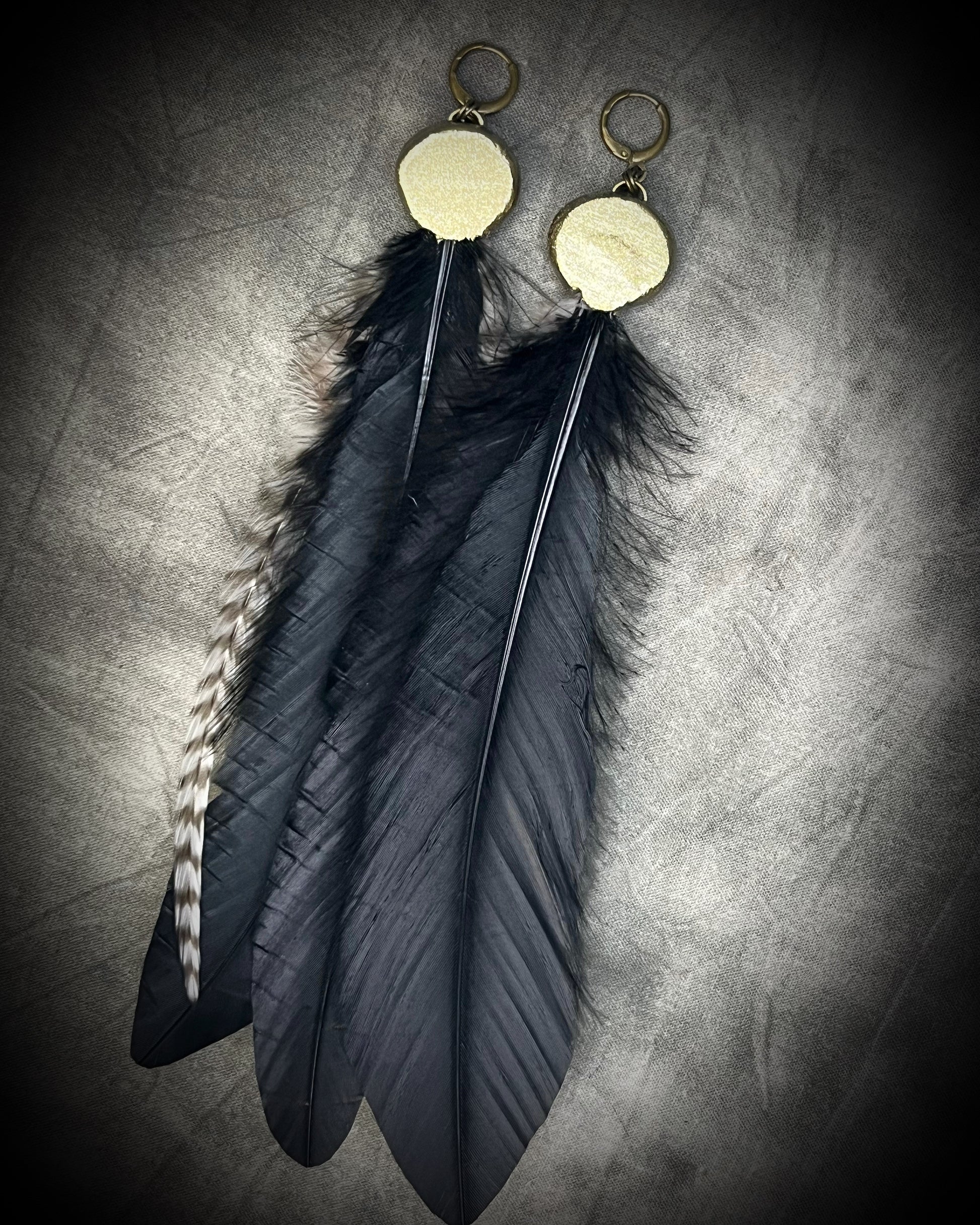 Turquoise and feather earrings with natural blue-green stone, gold finish, and hypoallergenic brass huggie hooks, handmade by Become Spellbound.