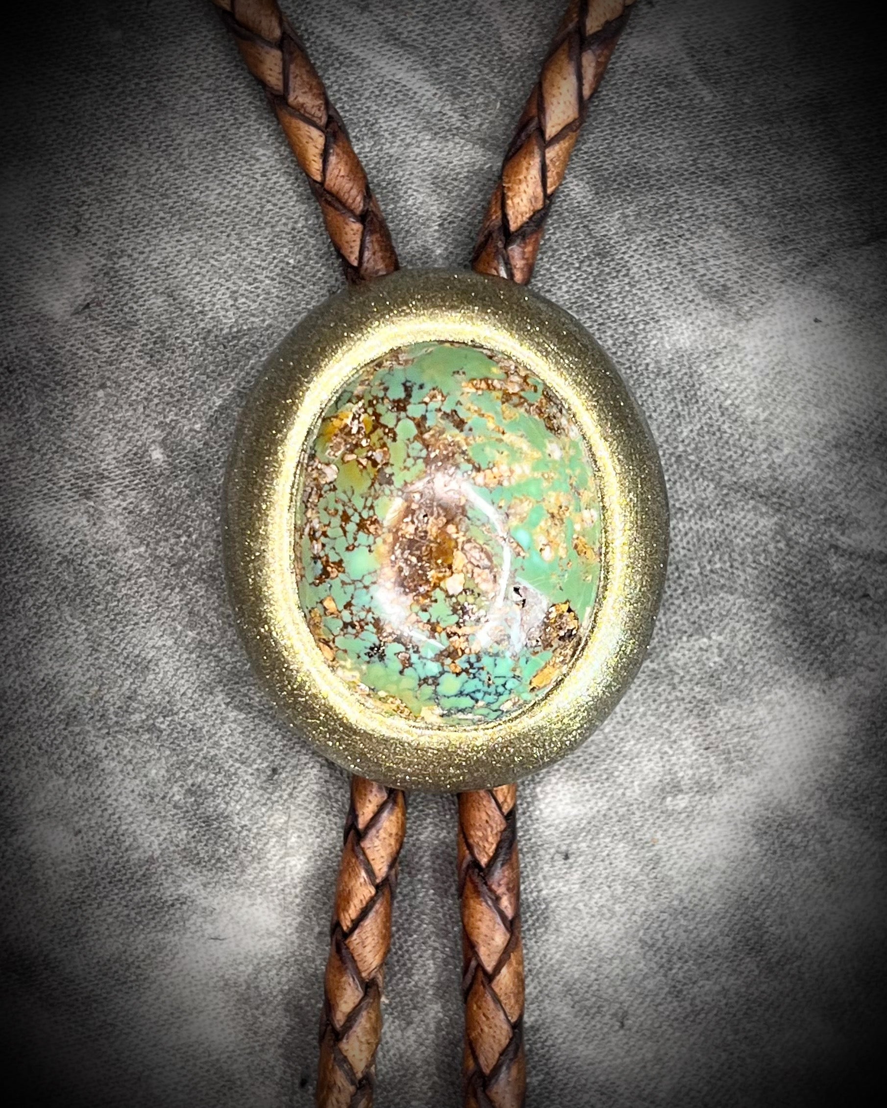 Turquoise bolo tie on brown leather – handmade gemstone bolo necklace, men’s Western fashion accessory, artisan crystal bolo tie for all genders.