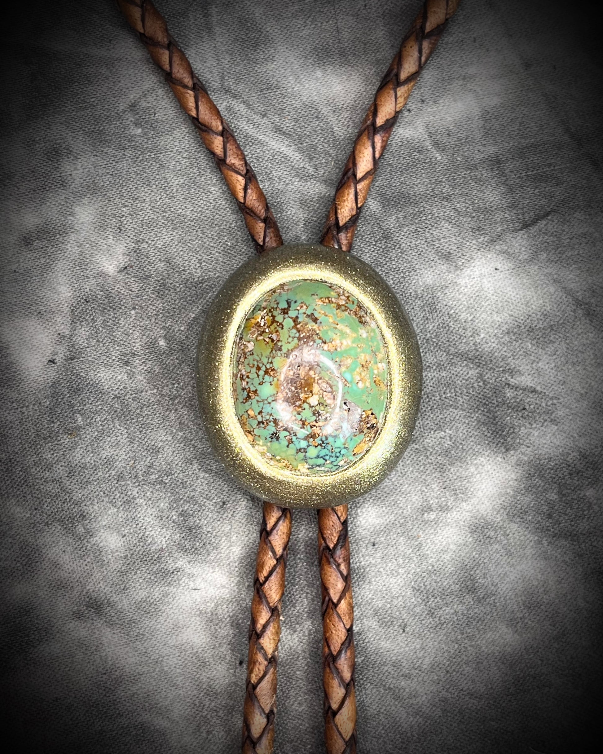 Turquoise bolo tie on brown leather – handmade gemstone bolo necklace, men’s Western fashion accessory, artisan crystal bolo tie for all genders.