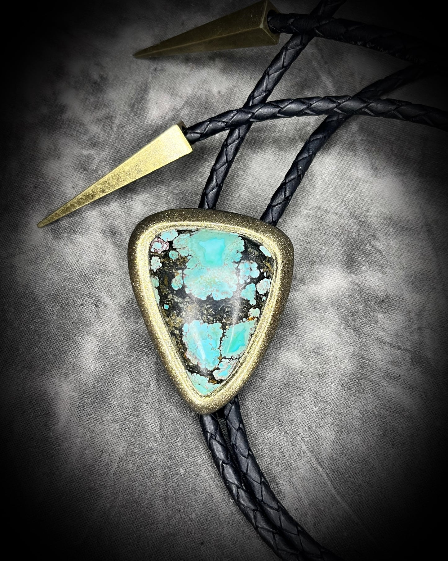 Turquoise handmade bolo tie for him with gold finish on black leather. Boho western bolo tie necklace for spiritual rebels.