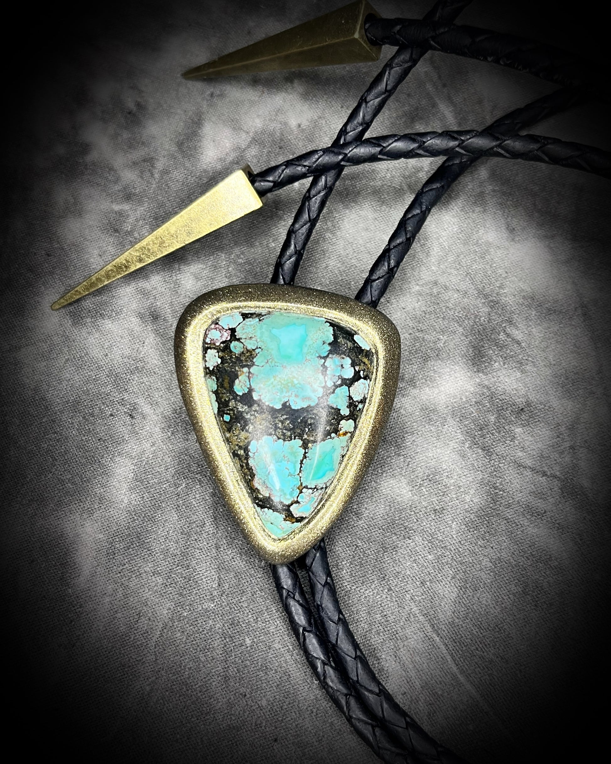 Turquoise handmade bolo tie for him with gold finish on black leather. Boho western bolo tie necklace for spiritual rebels.