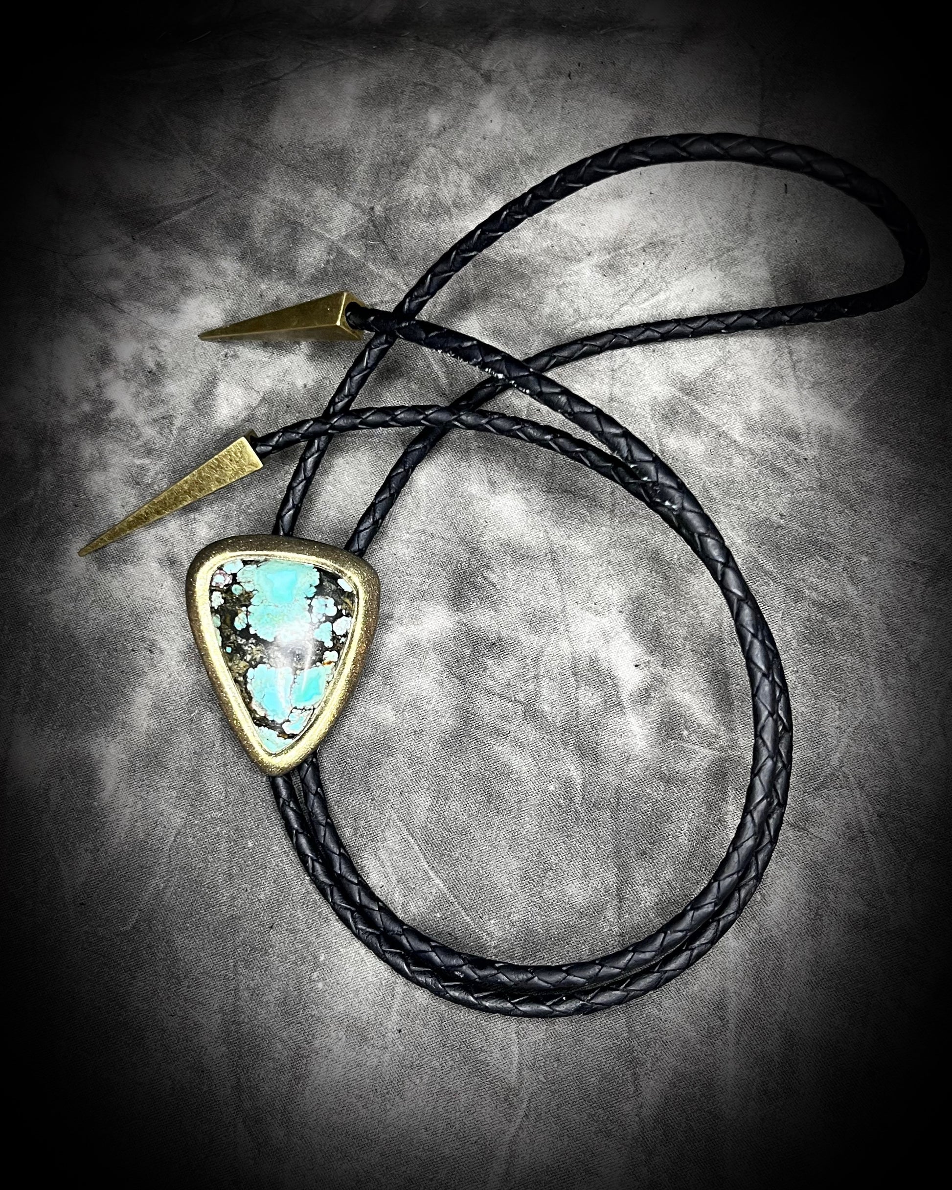 Turquoise handmade bolo tie for him with gold finish on black leather. Boho western bolo tie necklace for spiritual outlaws and Shaboozey fans.