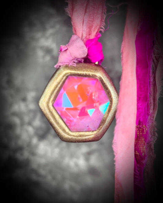 Opalescent unocorn vibes handmade pink quartz crystal necklace in a gold finish with magenta recycled silk for an eco-friendly and whimsical summer festival or vacation jewelry appeal.  