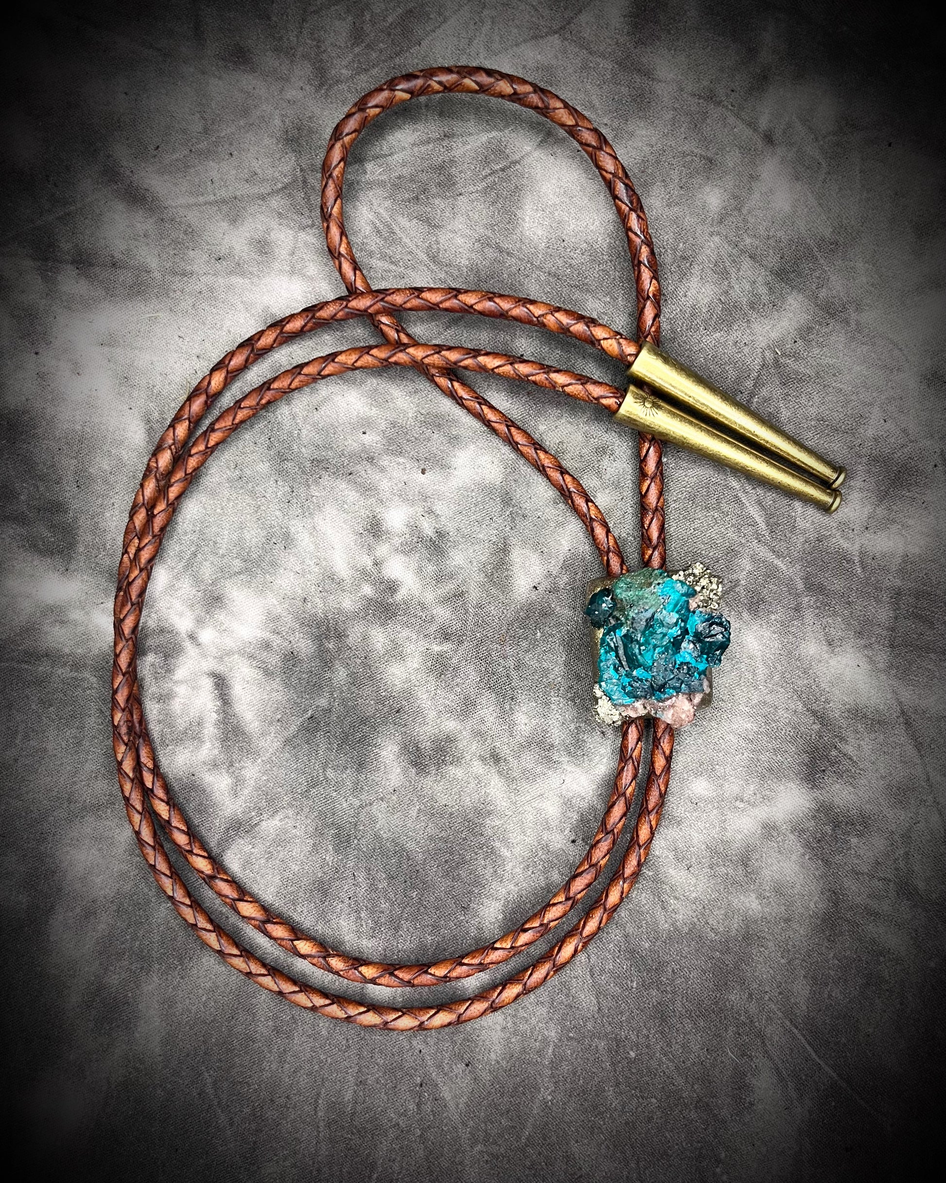 Dioptase and Pyrite bolo tie on brown leather – unique handmade bolo necklace, artisan gemstone bolo tie jewelry, mystical men’s bolo for bold style.